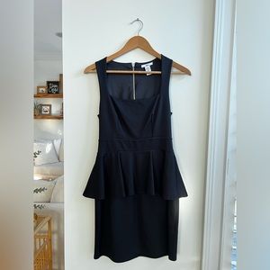 Black peplum dress. Sized small. Good condition.